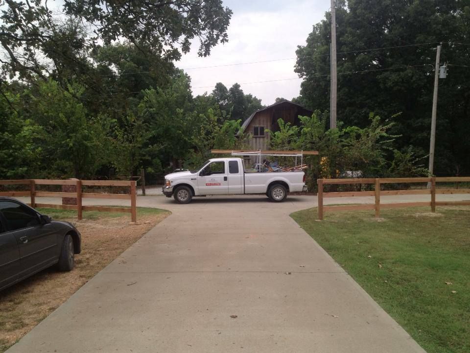 A white truck is parked on the side of a road