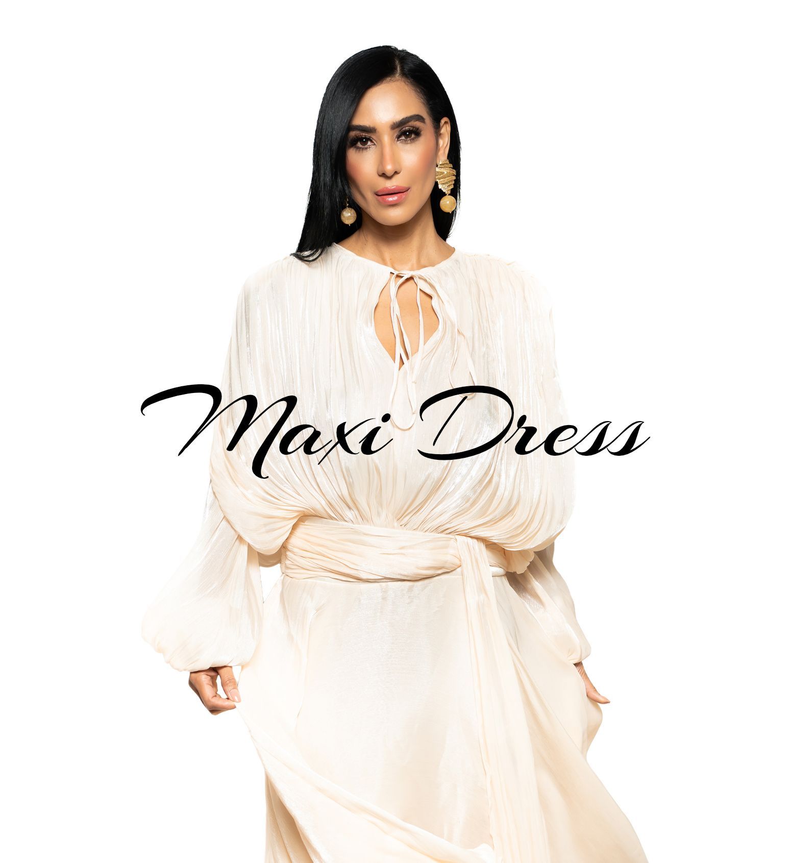 woman in a white beautiful flowy dress standing in a white background