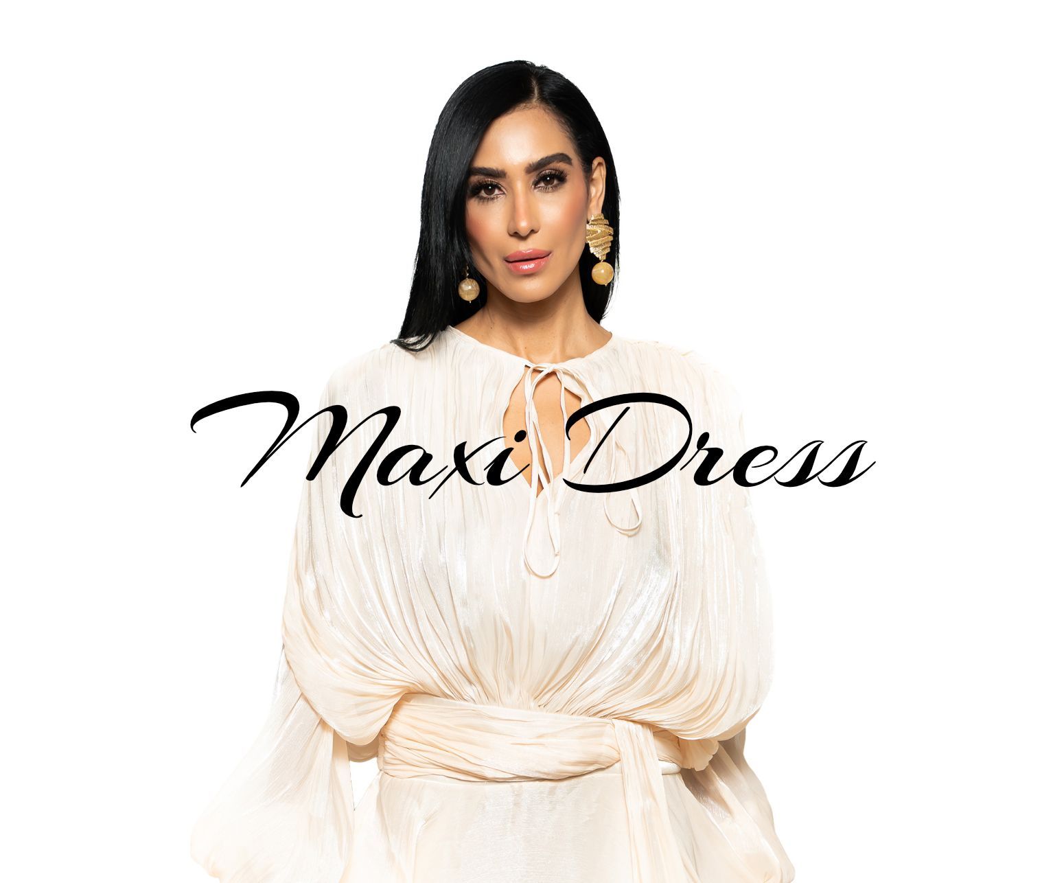 woman in a white flowy dress standing on a white background