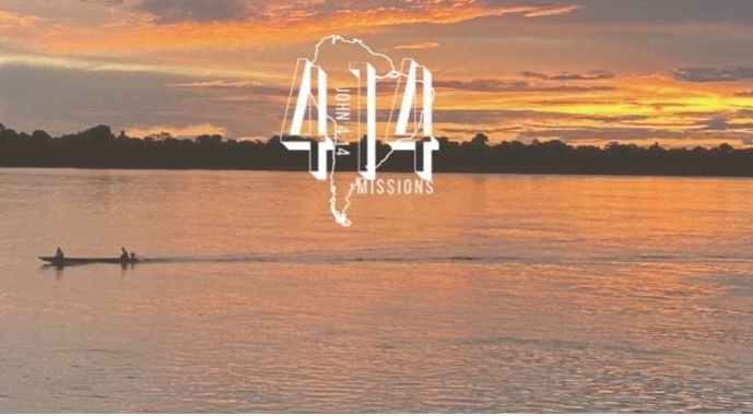 Sunset over a river with a small boat. 412 Missions logo over a map outline.