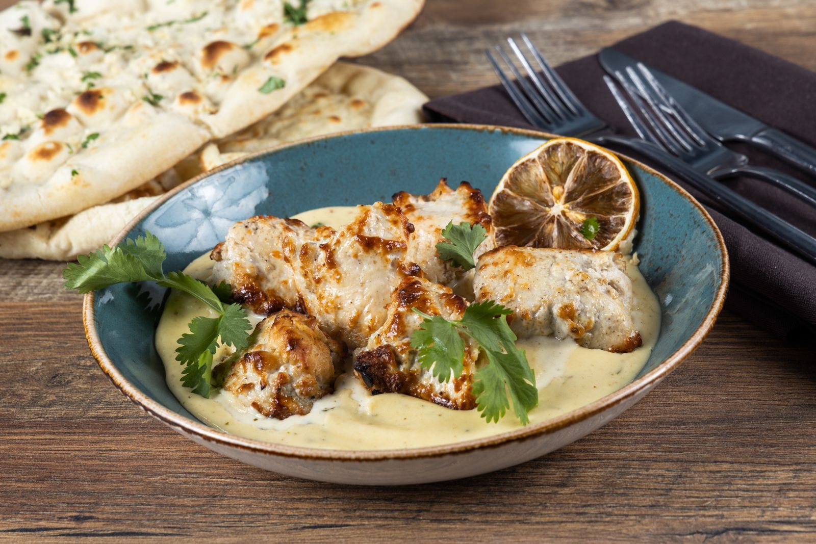 Chicken tikka malai in creamy lemon sauce.