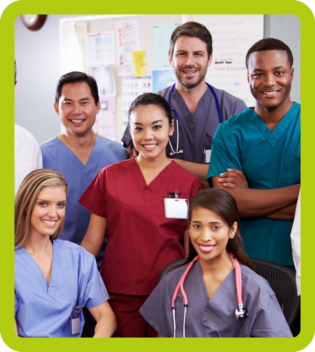 A group of doctors and nurses posing for a picture