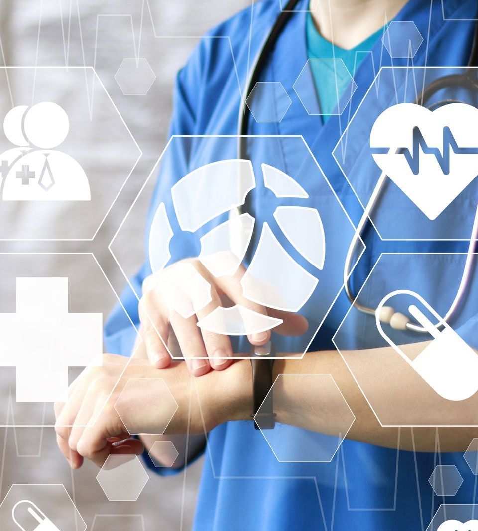 A doctor with a stethoscope around her neck is looking at her watch