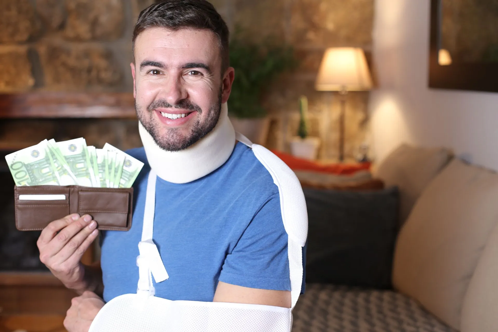 A man with a broken neck holds cash, highlighting Workers' Compensation Attorneys at Karl F. von Reuter, in St. Paul, MN