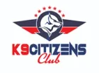 Logo for K9 Citizens Club featuring a dog head in a circle, with red, white, and blue wings and stars, and text.
