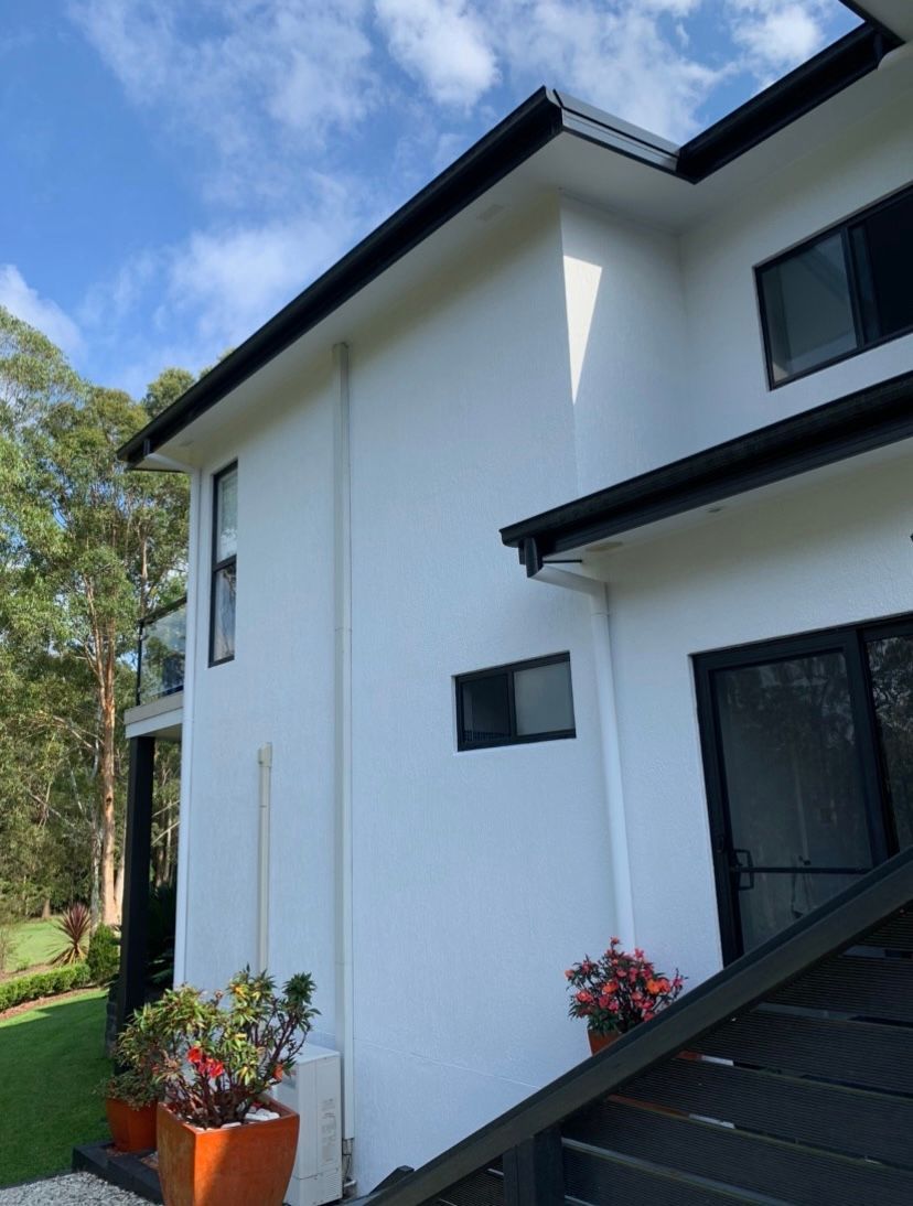 Paint Roller on the Wall During Painting — House Painting in Nabiac, NSW