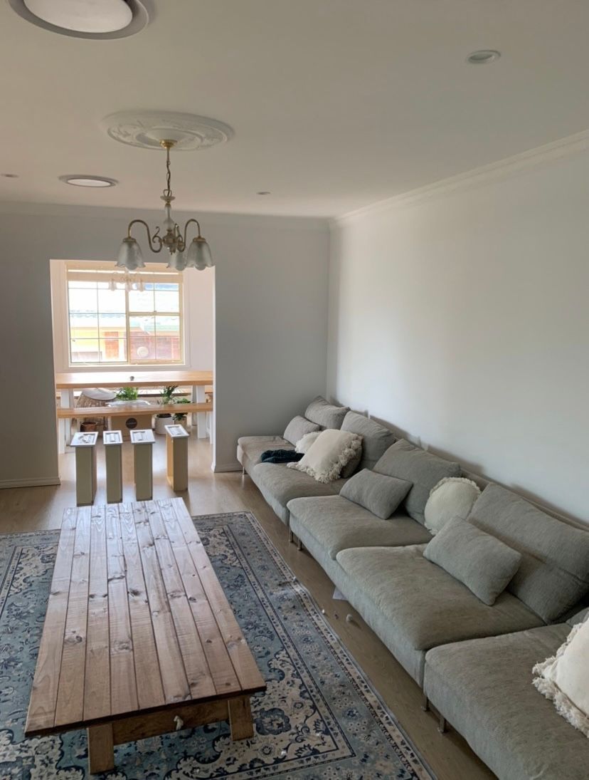 Painter Painting a House Wall — Professional Painting Service in Forster, NSW