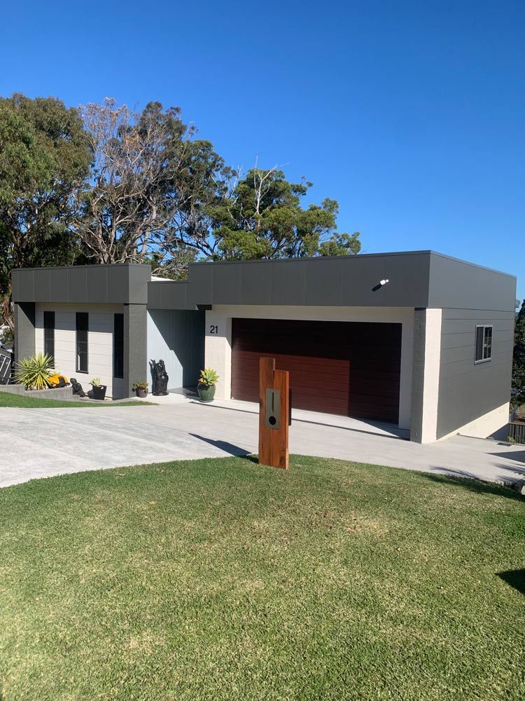 Home With Brown Garage Door — Painting in Forster