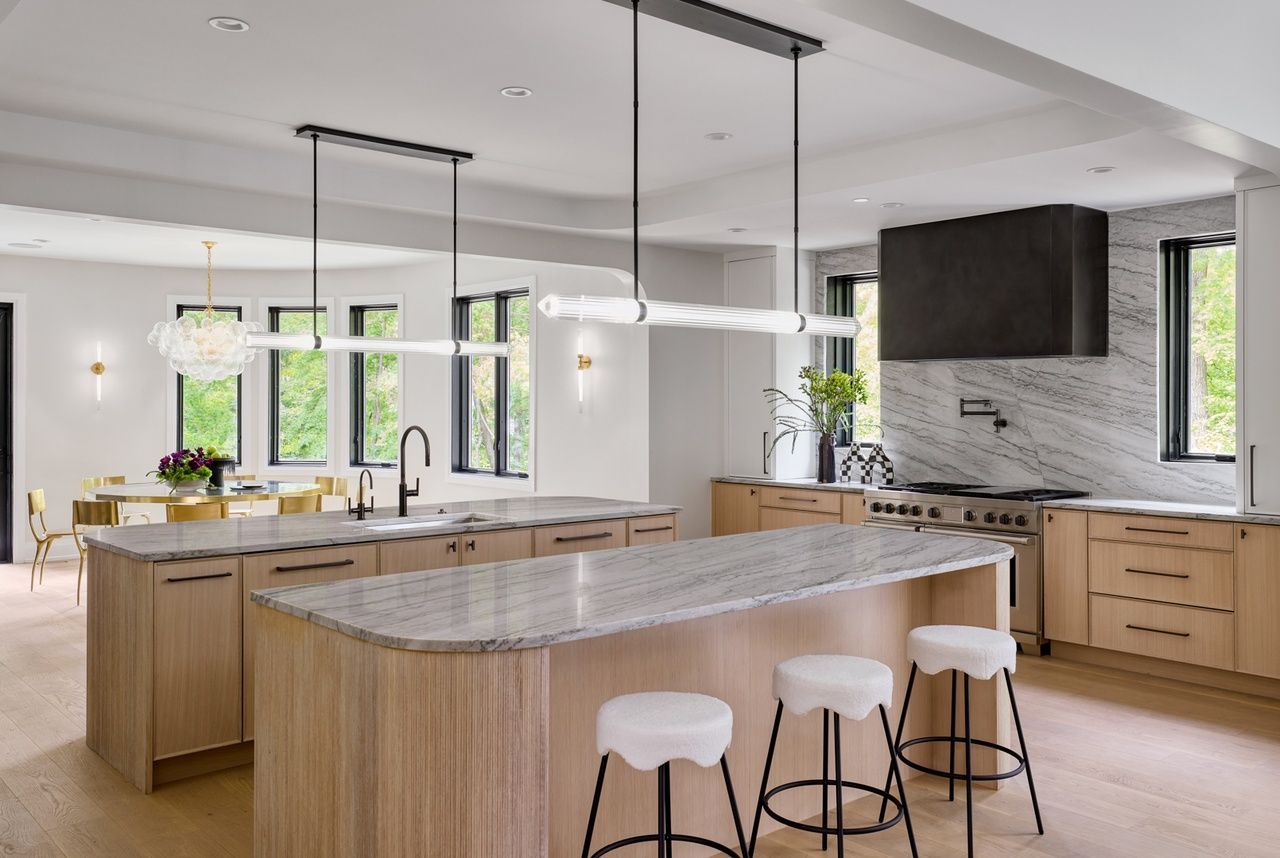 There is a large island in the middle of the kitchen.