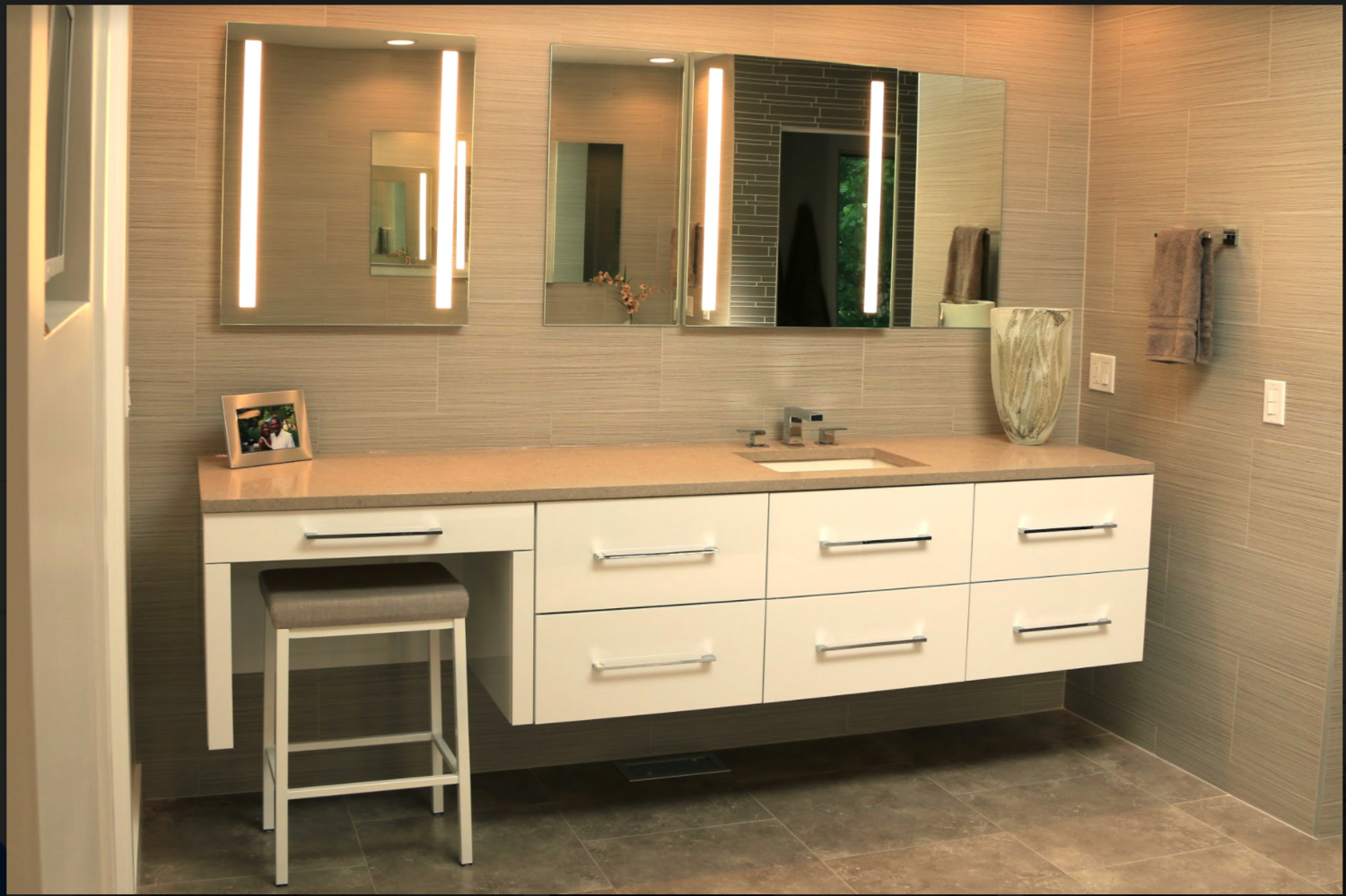A bathroom with two sinks and two mirrors