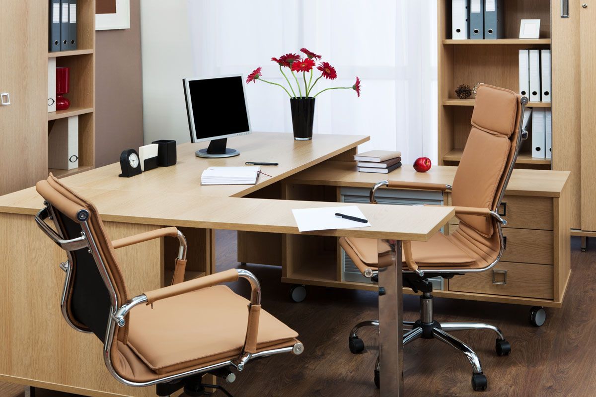 clean office desk with empty chairs
