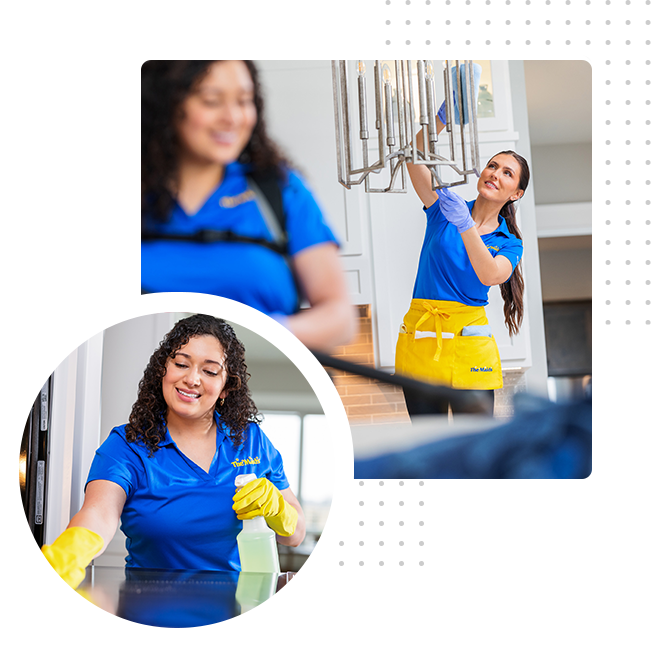 Cleaning worker in blue shirt and yellow gloves wipes a surface in a bright room.