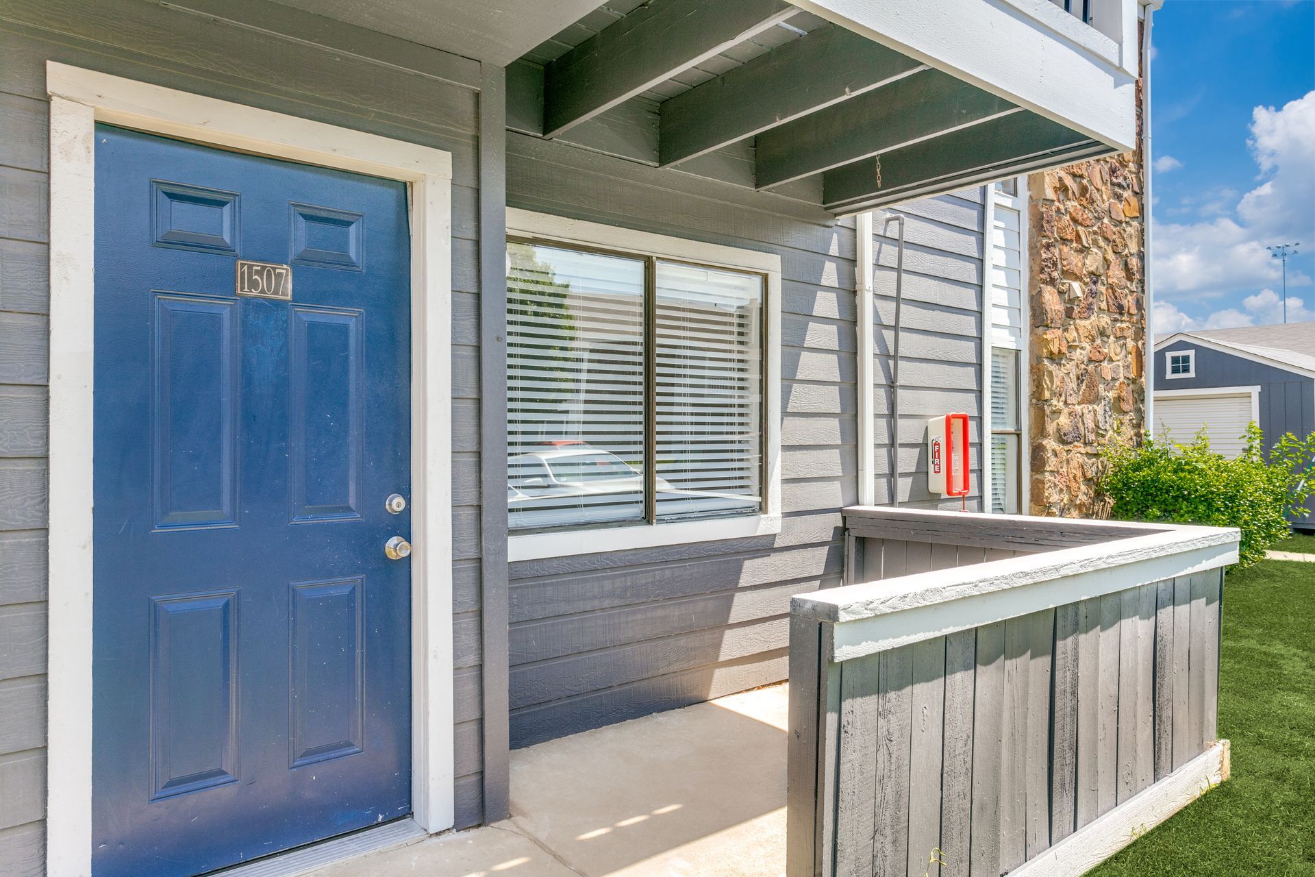 Blue apartment door with address 