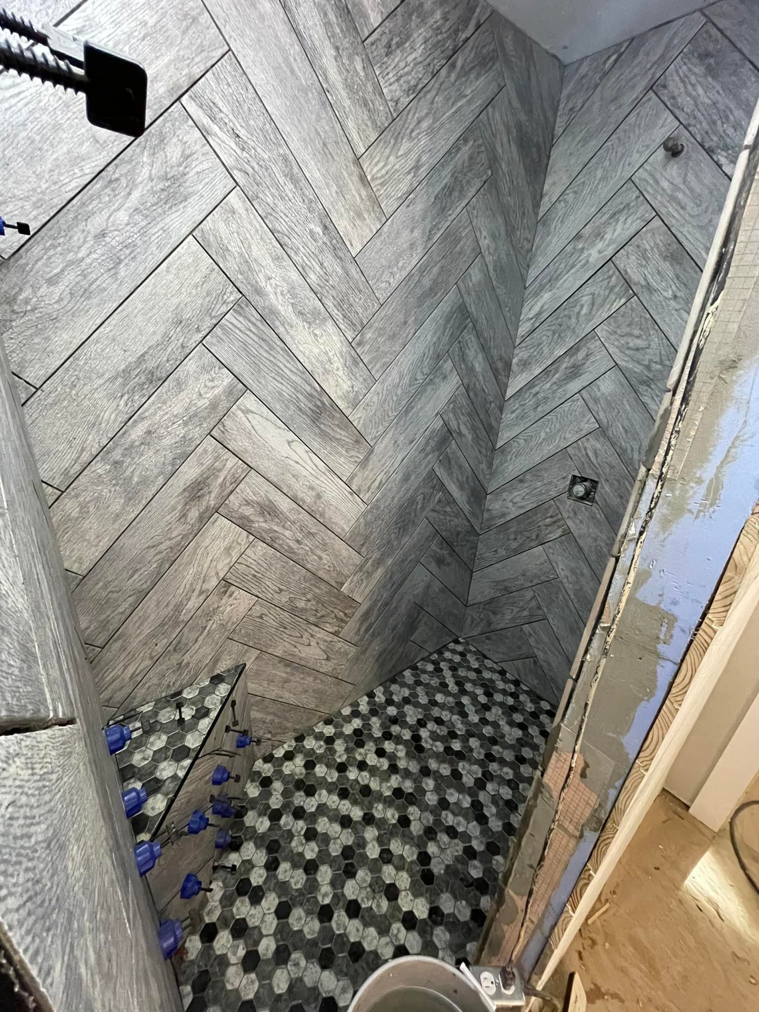 A bathroom with a walk in shower and a toilet.