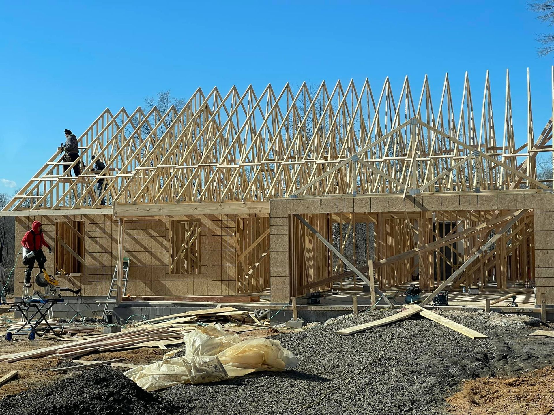 A house is being built with a lot of wooden beams.