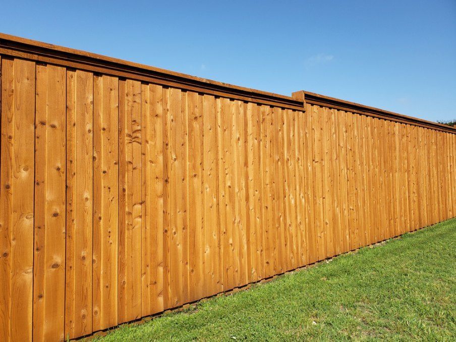Wooden Fence Stained a Golden Brown  — Capital Fencing in Queanbeyan, NSW