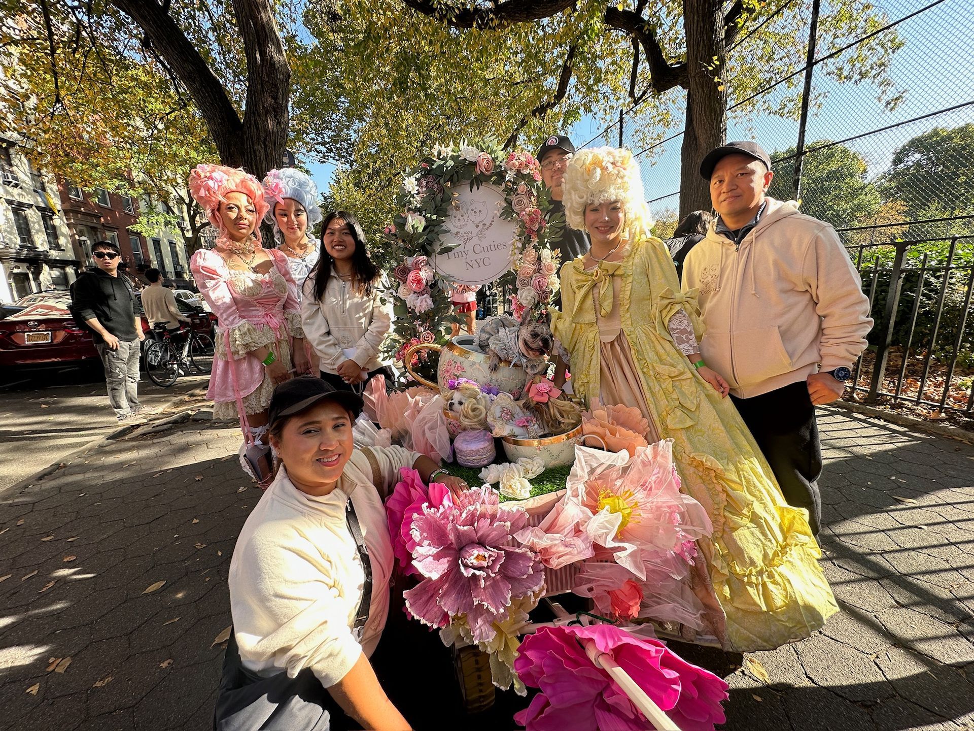 The Tiny Cuties NYC team and our dogs Muumi, Oreo, and Barbie in our Royal-tea Paw-ty dog float at the 2024 Tompkins Square Park Dog Halloween Parade.