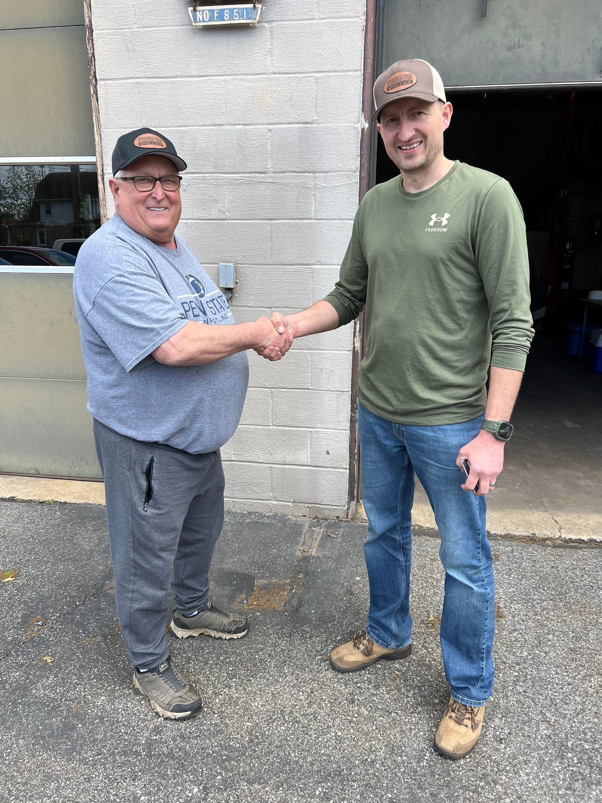 Technician And Customer Handshake Outside Shop | Absolute Auto Repairs & Sales
