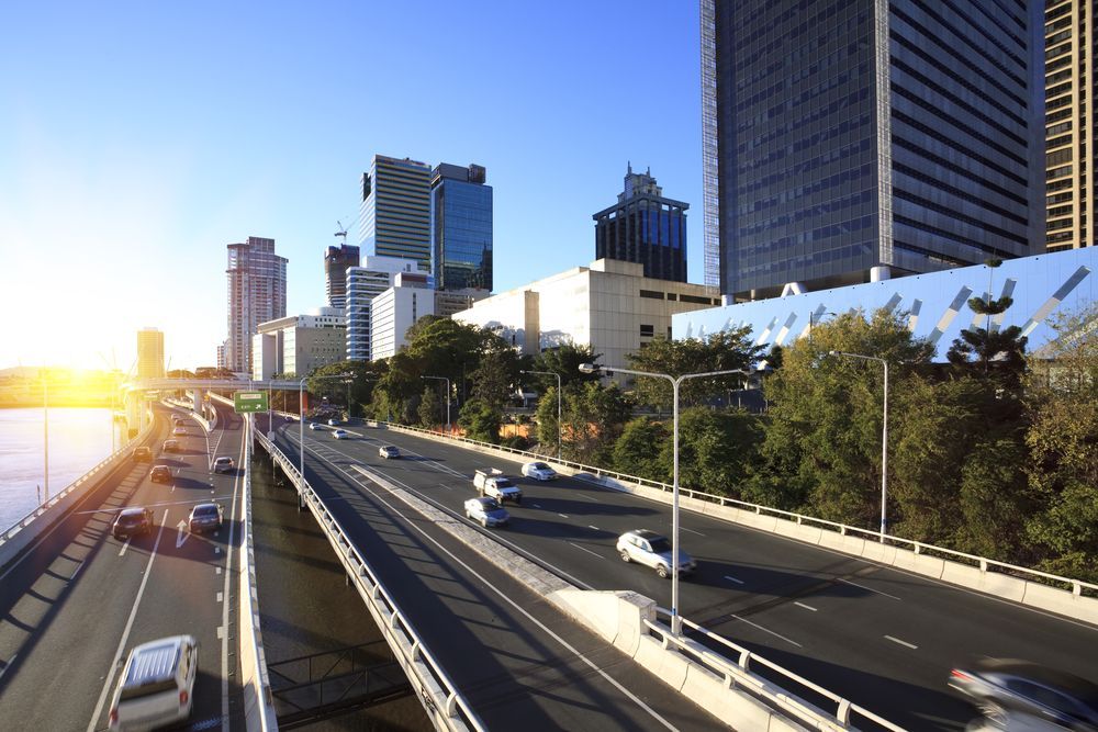 Highway in a City With Cars, Tall Buildings, and Bright Sunlight — Iconic Construction Industries in Brisbane, QLD