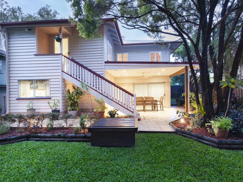 A White House with Stairs Leading up To the Second Floor — Iconic Construction Industries in Garbutt, QLD