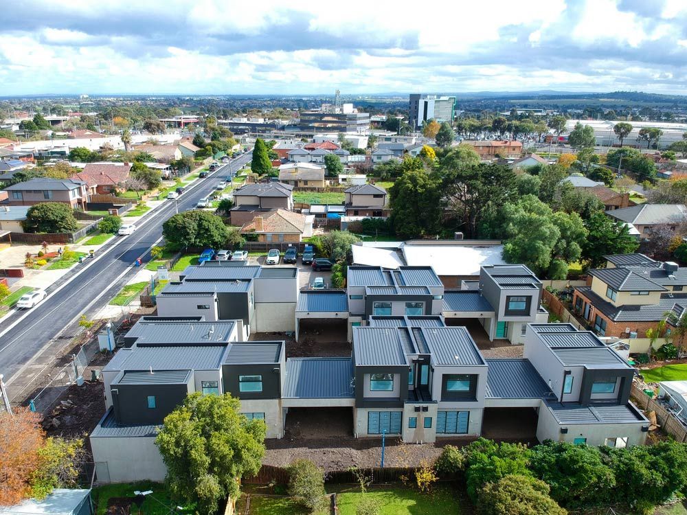 An Aerial View of A Residential Area with Lots of Houses and Trees — Iconic Construction Industries in Garbutt, QLD