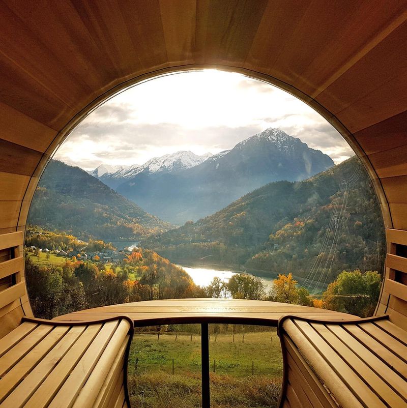 A view of mountains and a lake through a window