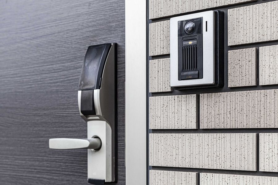 a security camera mounted on a wall next to a door