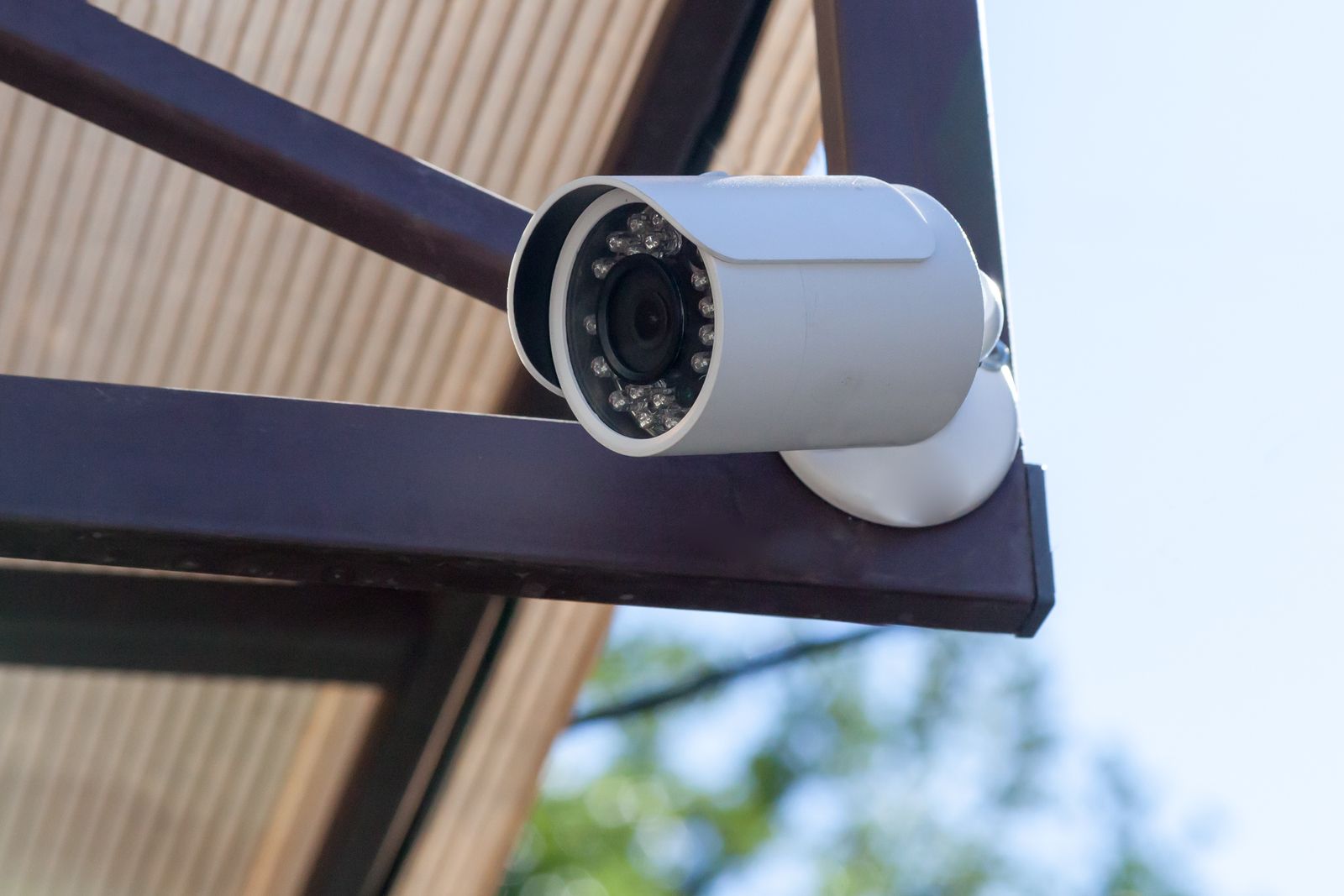 a security camera mounted on the side of a building