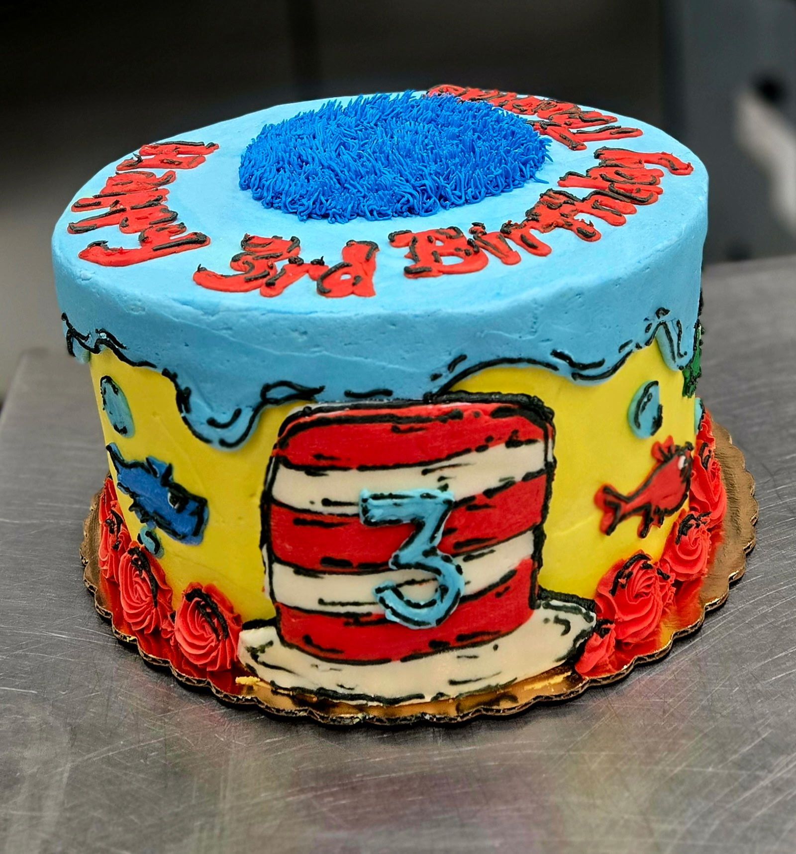Cat in the Hat-themed cake with blue frosting and