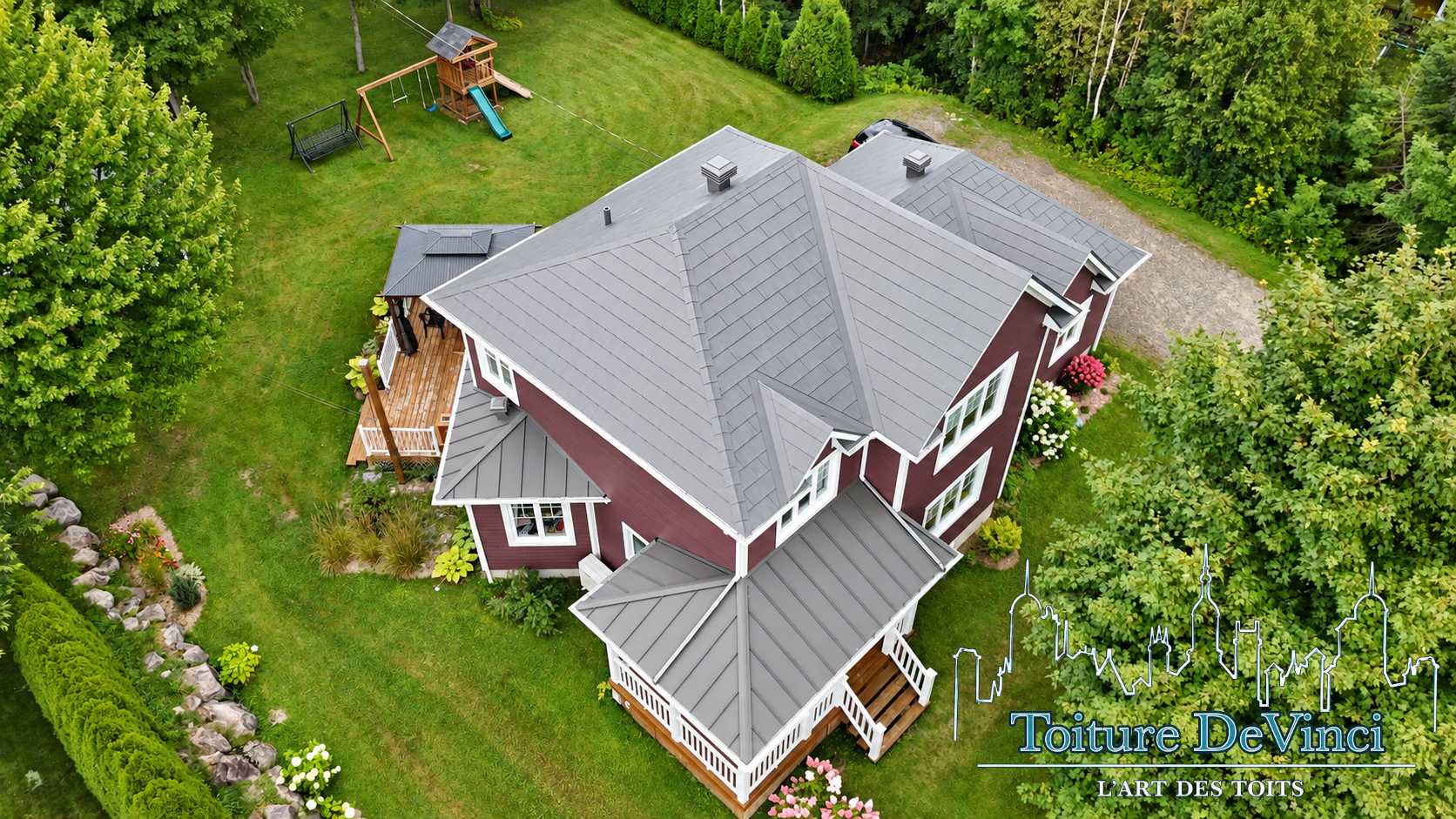 A large house with a metal roof is being built.