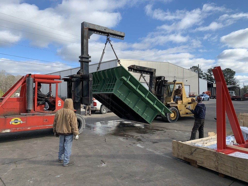 A yellow forklift is parked in a large warehouse A yellow forklift is parked in a large warehouse
