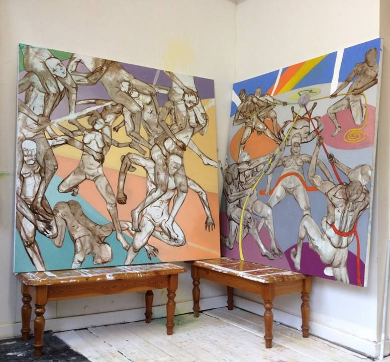 Two large paintings of human figures in action, leaning on small wooden tables. Colorful background.