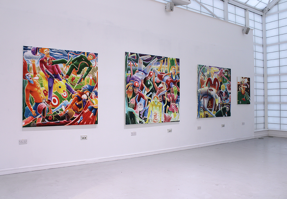 Art gallery with several colorful, abstract paintings hanging on white walls.
