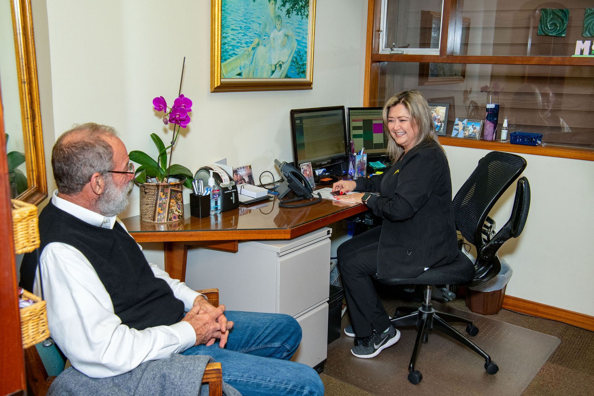 Top dentist speaking to dental patient | dental implants Corpus Christi TX
