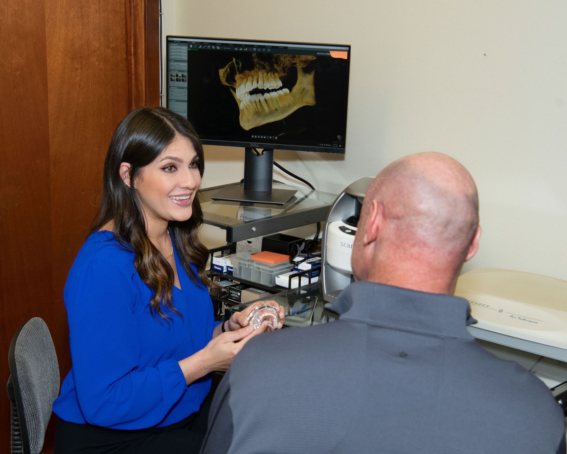 Top dentist speaking to dental patient | dental implants Corpus Christi TX