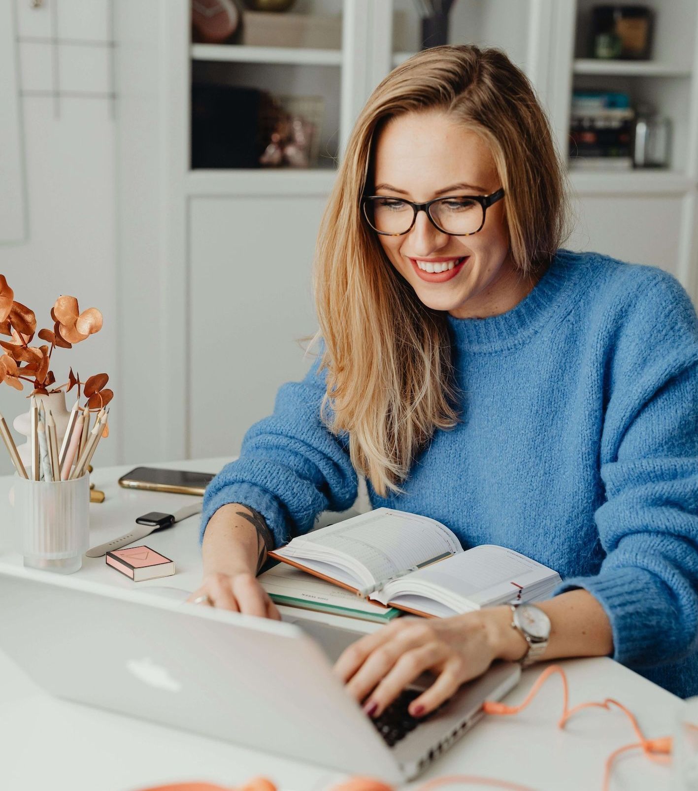 Young educator studying her Leadership Certification on laptop