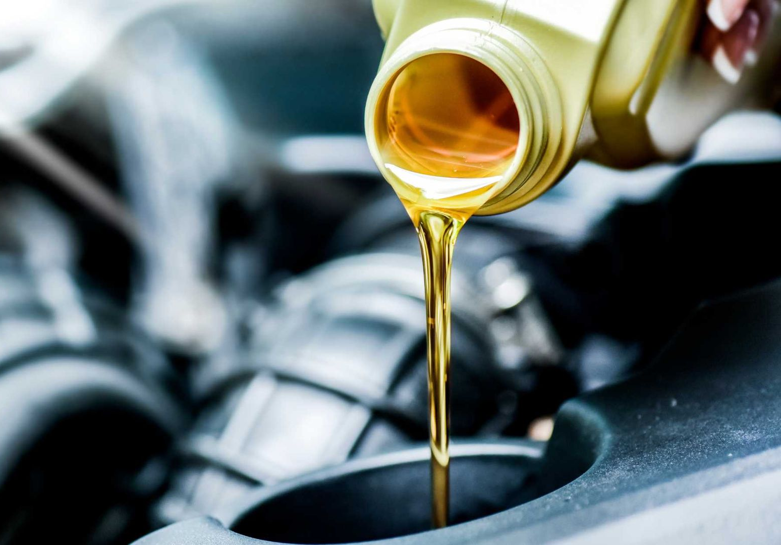 oil being poured into car