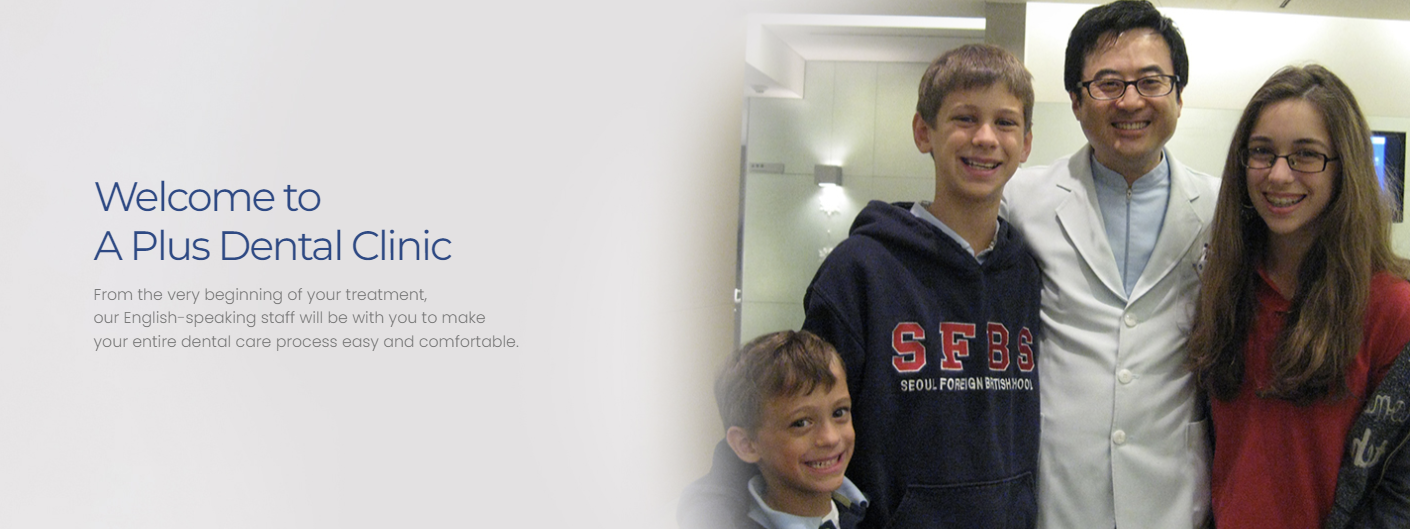 Two smiling boys visiting A Plus Dental Clinic