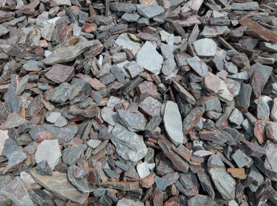 Pile of gray and brown rocks and gravel covering the ground