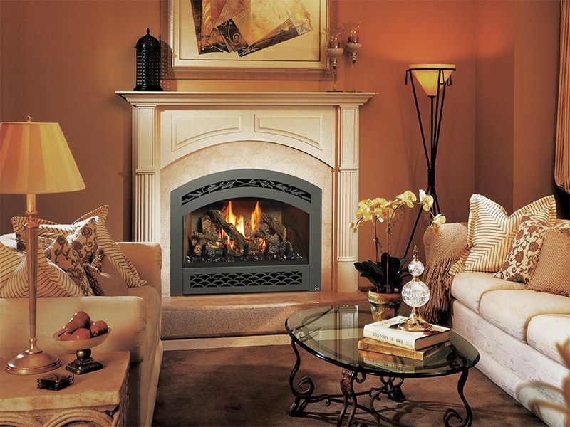 A living room with a fireplace and a couch