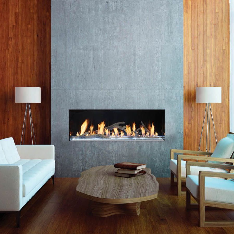 A living room with a fireplace and a couch and chairs