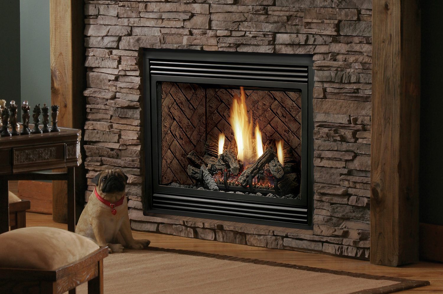 A dog is sitting in front of a fireplace in a living room.
