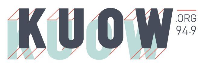 The KUOW 94.9 FM logo, featuring dark blue letters with a light blue 3D drop shadow on a white background.