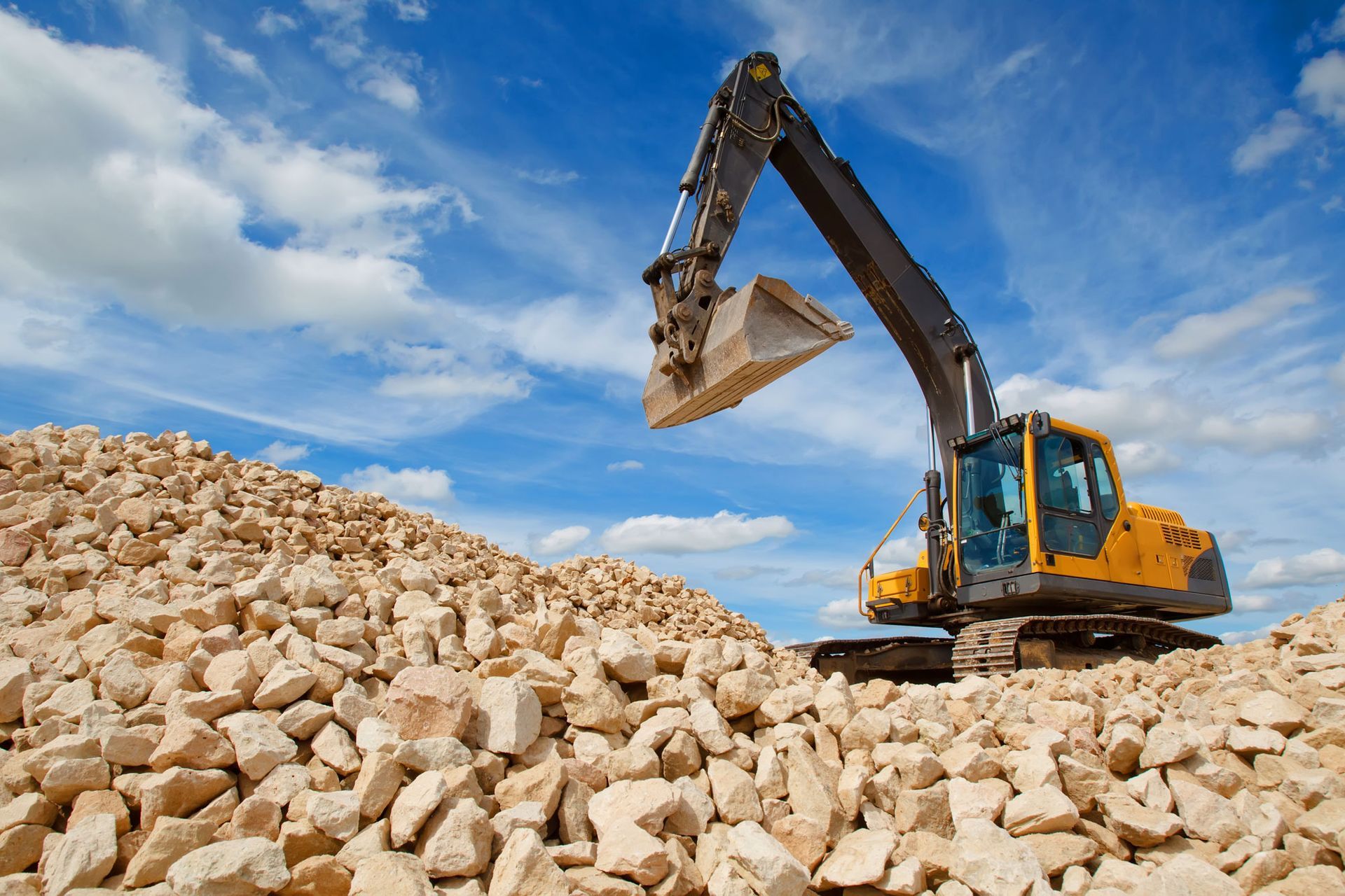 Excavator unloading gravel