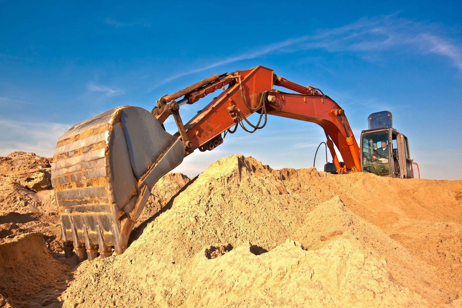 excavator during earth moving works outdoors at sand quarry
