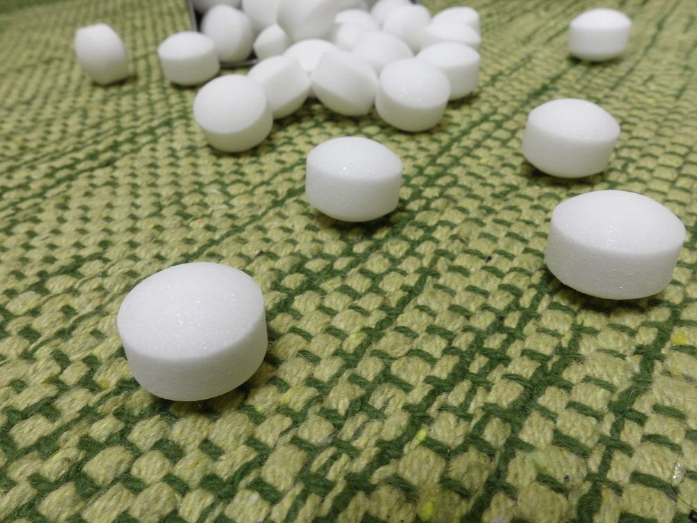 A Pile Of White Balls On A Green Blanket — ASAP Pest Control in Mermaid Beach, QLD