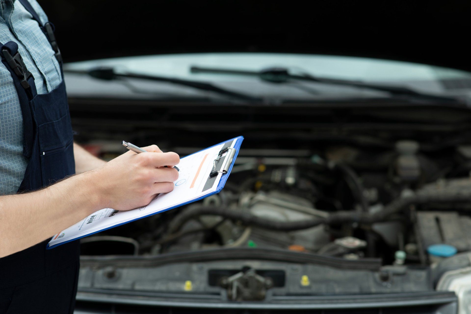 Mechanic Checking Engine — Vancouver, WA — Alpine Collision & Auto Repair Mechanic Checking Engine — Vancouver, WA — Alpine Collision & Auto Repair