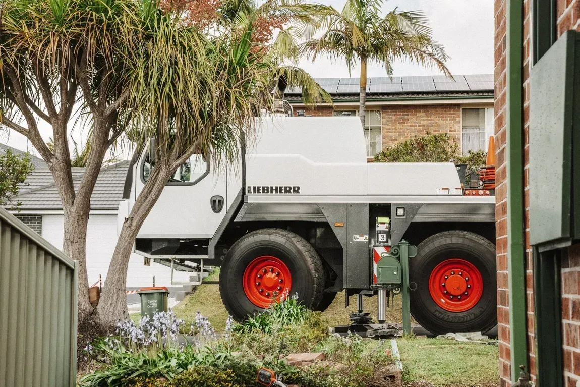 White Mobile Crane Outside — Wyong, Nsw — Mcphan Cranes & Transport
