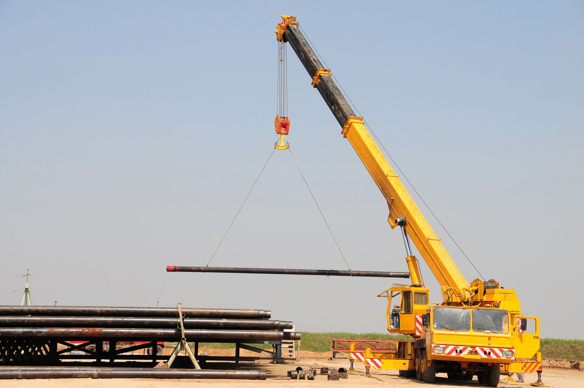 A Lifting Crane Which Is Used to Carry Heavy Loads in the Oil and Gas Industry — Wyong, Nsw — Mcphan Cranes & Transport