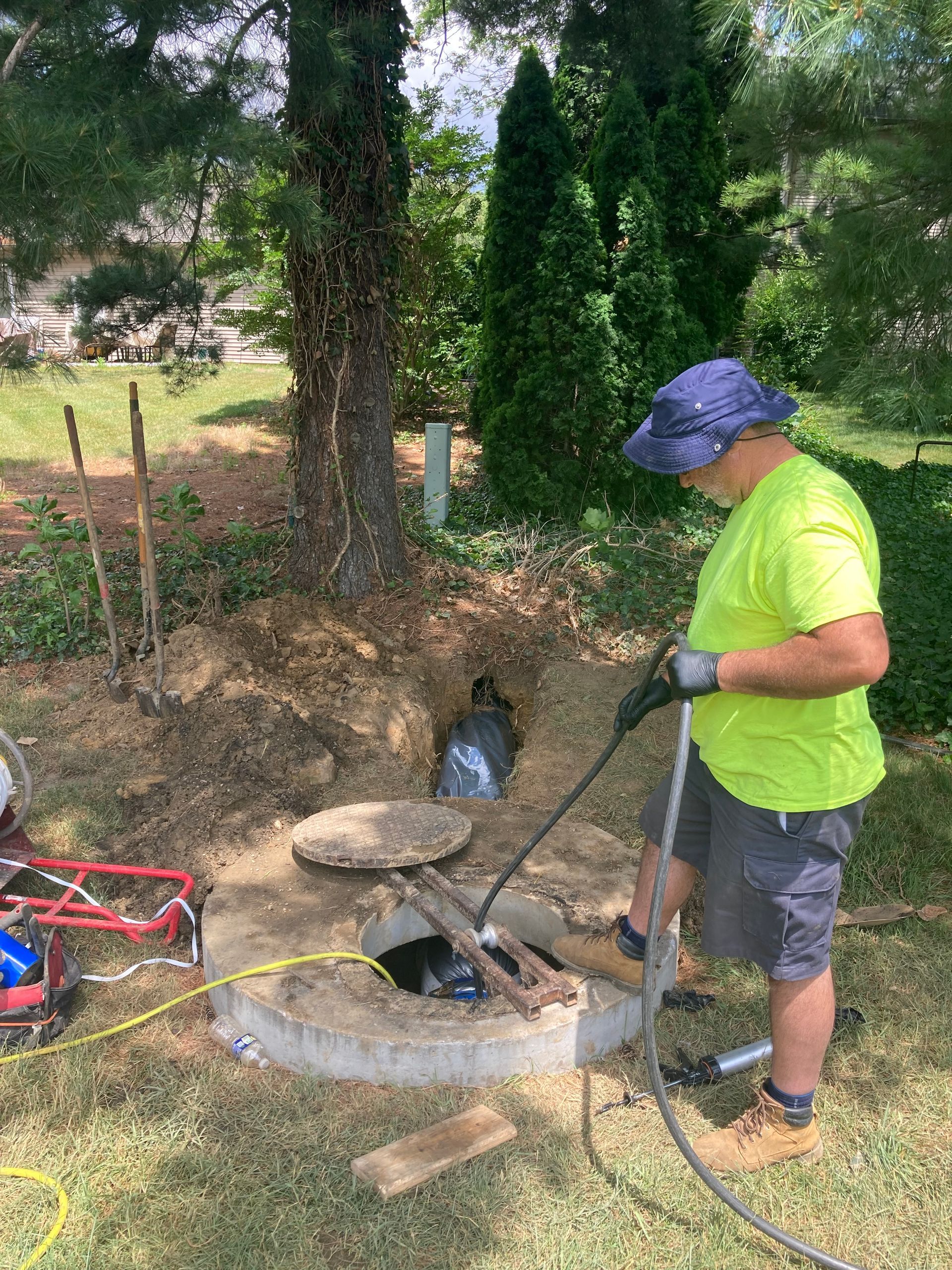 CIPP liner Alphaliner installed, inflated, and curing through open trench